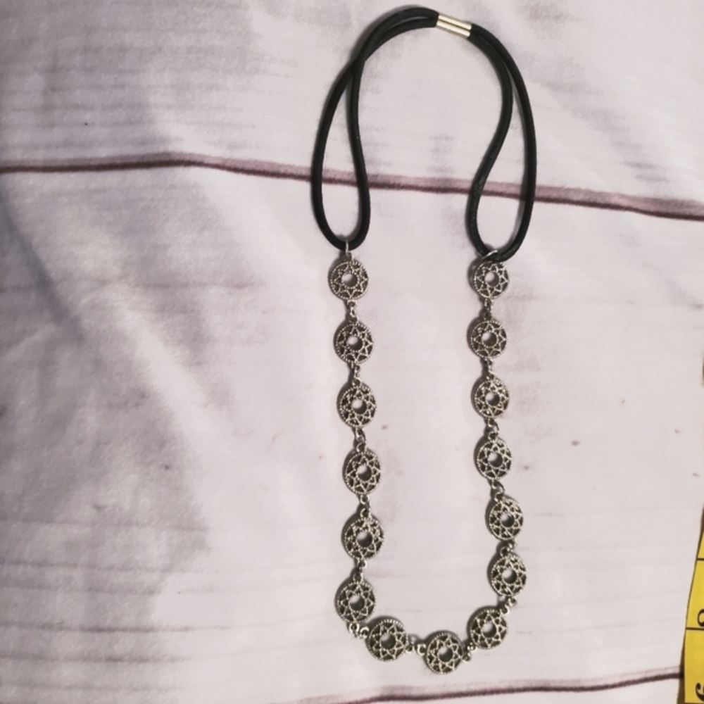 Silver circular stars with black band necklace NWOT